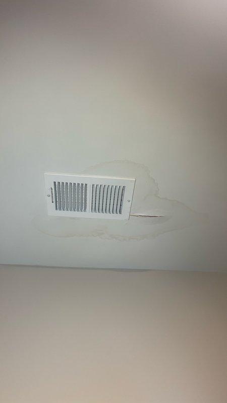 Responded to emergency service call for water leak at toilet fixture on first floor. Upon arrival, found water supply turned off by customer due to active leak. Inspected toilet base and identified source of leak at water supply connection point. Examined toilet mounting and floor seal integrity. Tightened supply line connection and verified proper seating of toilet base to floor flange. Checked for secondary moisture damage and identified water staining on ceiling below, indicating previous leak migration. Restored water supply and pressure-tested all connections to confirm leak resolution. Verified proper toilet operation and no active water discharge. Documented conditions with photographic evidence showing toilet installation and ceiling water damage patterns for maintenance records.