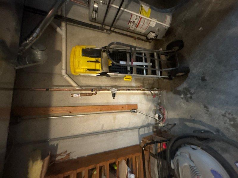 Completed comprehensive whole home plumbing inspection of residential property, examining all accessible water supply lines, drain systems, and plumbing fixtures throughout the structure. Inspected basement utility area including copper piping configurations, shut-off valves, and connections for proper installation and signs of leakage or corrosion. Documented system pressure readings and overall condition of visible plumbing infrastructure with photographic evidence for homeowner records.