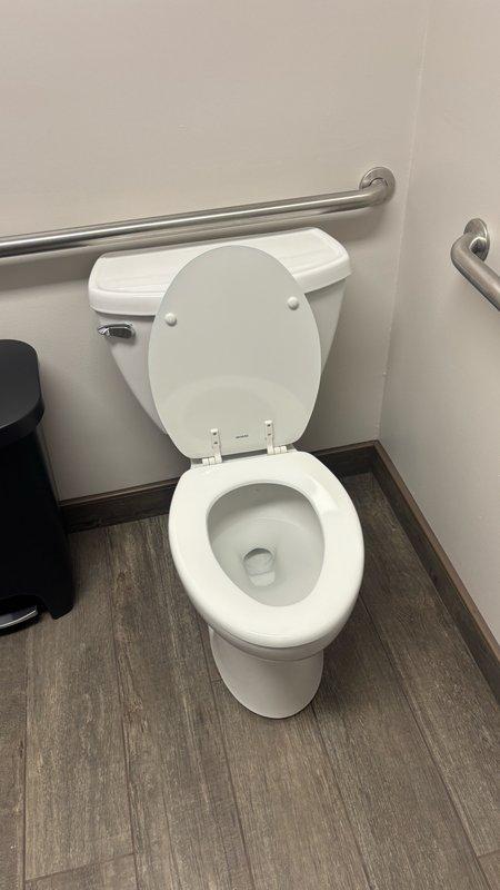 Removed two existing toilets from commercial bathroom facility and installed two new power flush toilets with accessibility features. Replaced wax rings and toilet flanges, installed new stainless steel braided supply lines, and properly secured all mounting hardware. Hauled away old fixtures and disposed of them appropriately. Performed final system testing to verify proper drainage function and checked all connections for leaks, confirming successful installation of both units.