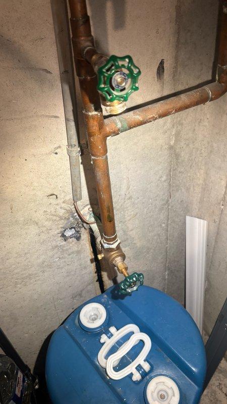 Responded to service call for pressure reducing valve (PRV) replacement in basement. Upon arrival, assessed existing water service system including copper piping, gate valves, and pressure tank configuration. Successfully replaced malfunctioning PRV to restore proper water pressure regulation to the residence. Verified all connections were secure and system was operating within normal pressure parameters upon completion.