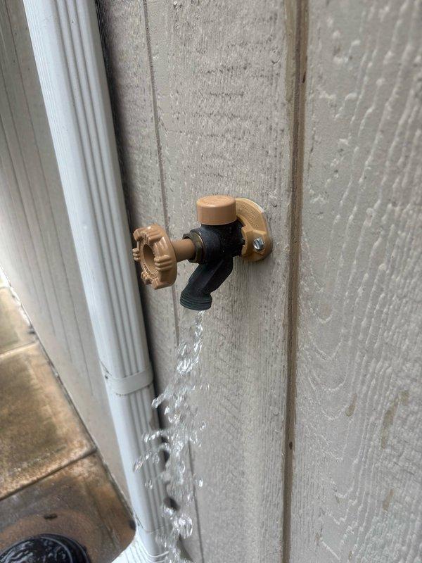 Completed comprehensive plumbing inspection of residential property. Documented exterior hose bib with active water leak requiring immediate attention, as well as interior gas shut-off valve and copper piping system showing age-related wear and wall damage in mechanical space.