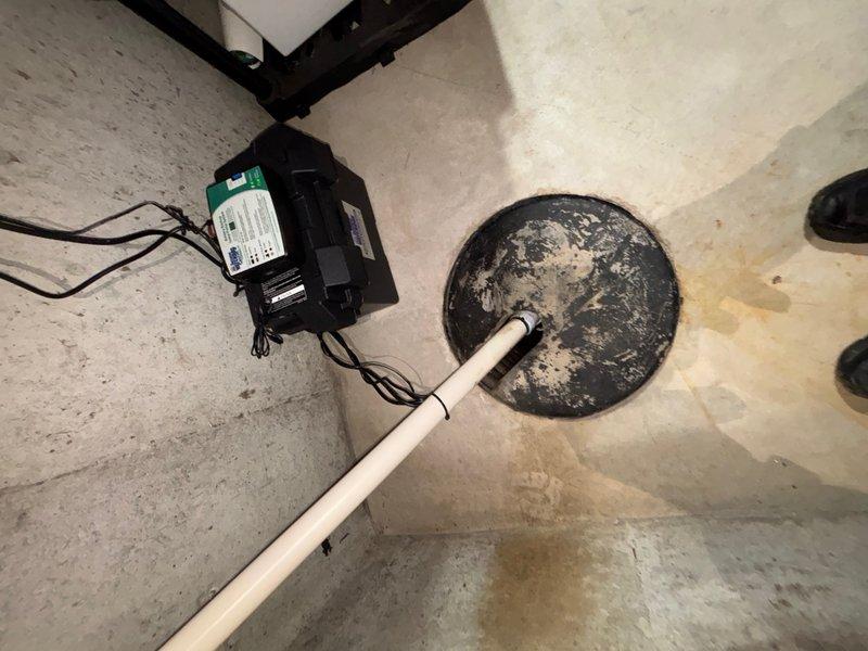 Responded to service call for sump pump system activating backup battery immediately upon operation. Upon arrival, inspected sump pump basin and primary pump unit in basement utility area. Found primary sump pump failing to engage properly, causing system to default to battery backup power instead of running on AC power. Tested pump operation and verified electrical connections to primary pump unit. Identified issue with pump float switch mechanism preventing proper activation of primary pump motor. Adjusted float switch assembly and cleared debris from basin that was interfering with float movement. Cycled system multiple times to confirm primary pump now activating correctly on AC power without triggering backup battery system. Verified discharge piping clear and operational. System restored to normal function with primary pump responding appropriately to water level changes.