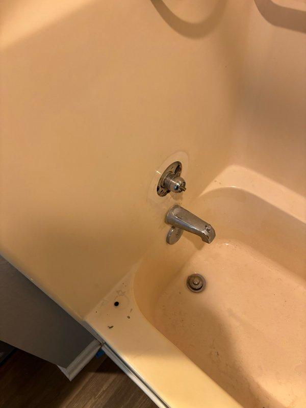 Responded to service call for master bathroom faucet repair. Upon arrival, inspected the bathtub faucet assembly which included a chrome-plated tub spout and single-handle shower/bath control valve with temperature indicator dial. Assessed the fixture's condition and functionality, documented the existing installation with chrome finishes and acrylic handle mechanism. Completed necessary repairs to restore proper faucet operation in the master bathroom.