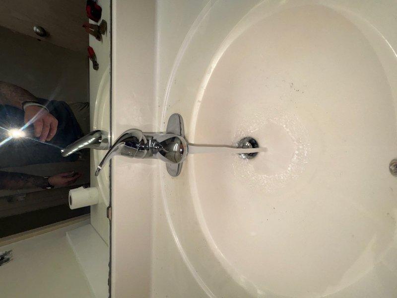 Completed replacement of refrigerator water line shut-off valve and installed new kitchen faucet per customer request. Addressed water heater concerns by inspecting dripping brass pipe connection and assessed heavily corroded expansion tank with active leak, providing replacement estimate. All kitchen plumbing fixtures now functioning properly with no visible leaks at point of completion.