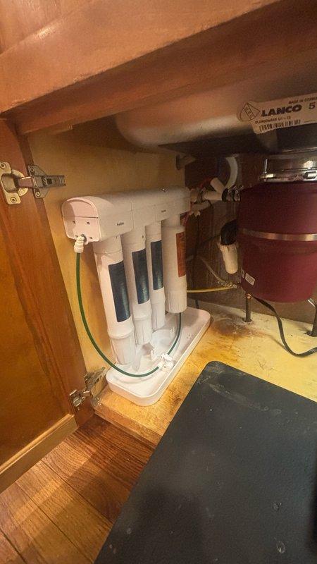 Installed customer-provided Kohler faucet in kitchen. Connected hot and cold water supply lines using braided stainless steel flex lines with proper fittings, ensuring secure connections to existing under-sink plumbing. Verified all connections for leaks and confirmed proper operation of new faucet installation.