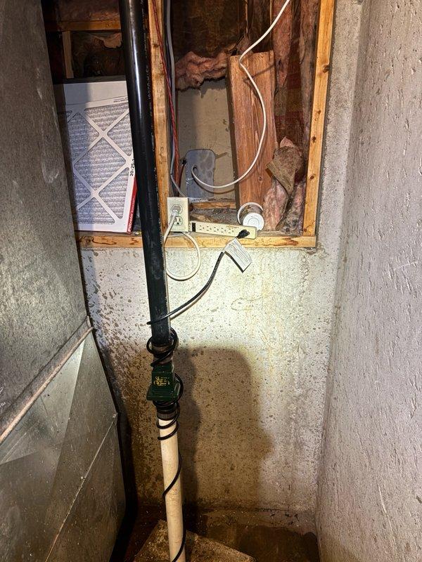 Successfully installed customer-supplied sump pump in basement utility area. Installation included proper positioning of pump basin, connection of discharge piping using PVC with appropriate fittings and flexible couplings, and routing of electrical supply with secure fastening. All connections were tested for proper operation and verified discharge flow through existing piping system.