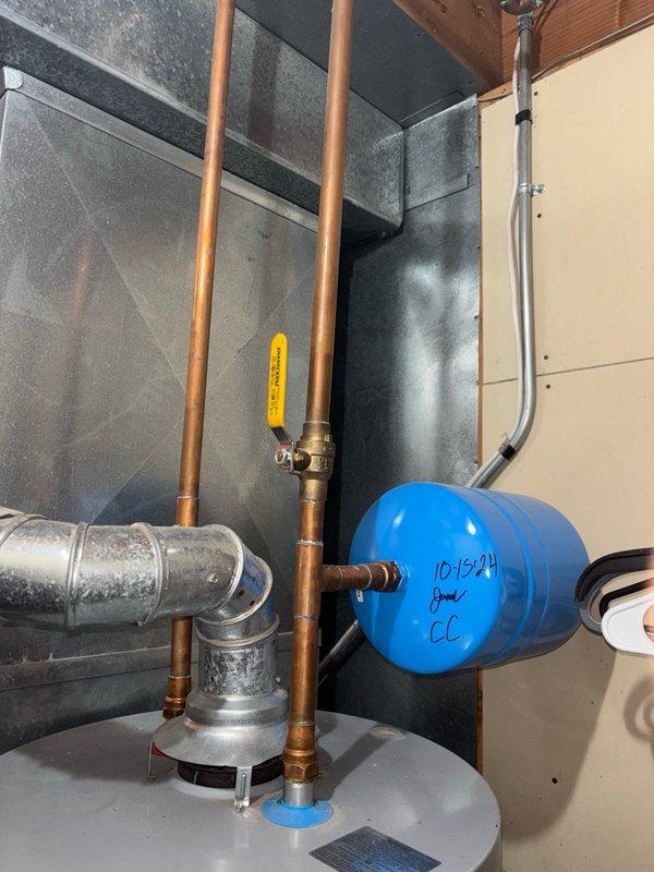 Responded to emergency service call for gas water heater that would not fire up and pilot light could not be established. Upon arrival, inspected the water heater unit in walk-in basement. Performed diagnostic assessment of the pilot assembly, thermocouple, and gas control valve. Cleaned burner assembly and pilot orifice to remove accumulated debris and dust that was preventing proper ignition. Verified gas supply line pressure and confirmed adequate flow to the unit. Successfully re-established pilot light and tested main burner operation. Main burner ignited properly with characteristic blue flame across the burner assembly, indicating proper air-to-fuel mixture and complete combustion. Inspected heat exchanger baffle plate and confirmed proper flame distribution. Verified all safety controls were functioning correctly, including thermocouple and high-limit switch. Tested temperature and pressure relief valve for proper operation. Confirmed water heating system returned to normal ope