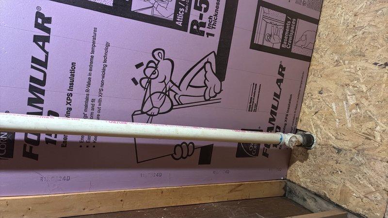 Completed plumbing installation inspection and verification at new construction site. Confirmed proper installation of PEX water distribution lines secured to wall framing with rigid foam insulation panels (R-5 rated) properly installed against OSB sheathing. Inspected under-sink plumbing connections including braided stainless steel flexible supply lines, shut-off valves, and associated fittings to ensure leak-free operation and code compliance.