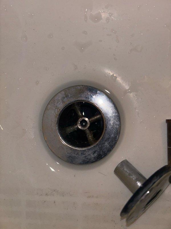 Responded to service call for clogged bathtub drain in bathroom. Upon inspection, successfully cleared the obstruction and restored proper drainage function. Documentation photos captured showing completed work and drain operating normally with no standing water present.
