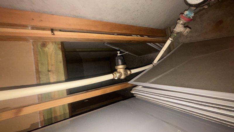 Completed comprehensive plumbing system inspection in basement and attic mechanical spaces. Evaluated condition of water supply lines, drain piping, and associated fixtures including PVC drainage systems, aged metal supply piping with brass fittings, and verified proper clearances around HVAC equipment. All accessible plumbing components were visually inspected and documented photographically for customer records.