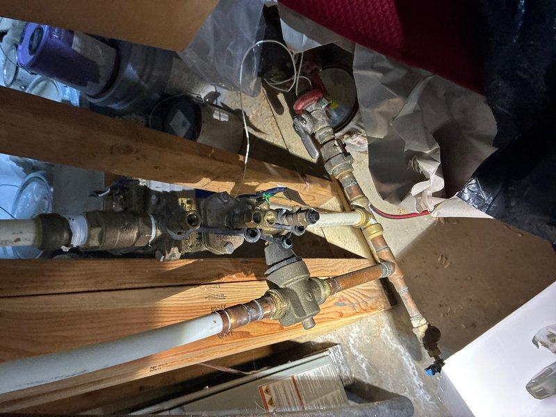 Completed comprehensive yearly plumbing maintenance and whole-home inspection. Examined toilet tank flush mechanism, confirming proper operation of flapper valve and chain assembly, noting minor mineral deposits consistent with normal use. Inspected under-floor plumbing infrastructure including supply lines, shut-off valves, and PVC drainage systems, verifying all connections and fixtures are functioning correctly with no leaks detected.