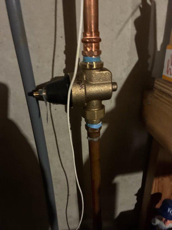 Completed scheduled plumbing maintenance inspection and verification of fixtures. Inspected under-sink shut-off valves with braided supply lines and pressure relief valve assembly with copper piping, confirming all connections are secure and functioning properly. All plumbing components show no signs of leaks or deterioration, and system is operating within normal parameters.
