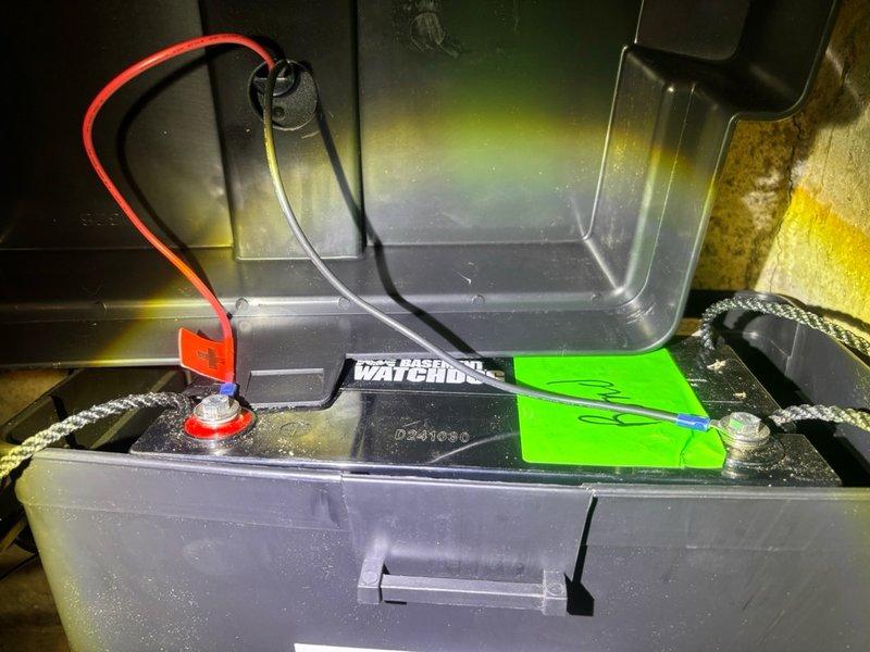Responded to callback regarding backup sump pump battery system installation issue in basement. Upon arrival, inspected battery compartment and confirmed improper mounting hardware had been used during initial installation. Replaced incorrect bolts with proper fasteners to secure battery housing. Addressed audible alarm condition by reconnecting battery terminals with proper torque specifications and verifying secure cable connections. Tested system operation to confirm battery charging properly and alarm condition resolved. Unit now functioning as designed with all connections secure and properly installed.