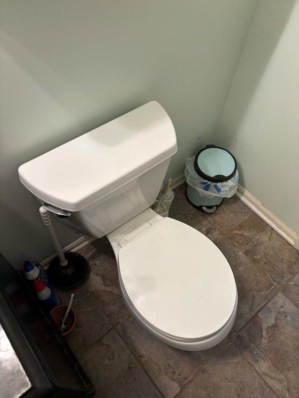 Responded to service call for clogged toilet on main level hallway bathroom. Upon arrival, assessed the toilet fixture and surrounding plumbing system. Successfully cleared the obstruction using appropriate drain clearing equipment and techniques. Verified proper flushing operation and drainage flow upon completion. Also inspected floor drain in bathroom, noting significant rust and corrosion present on drain fixture requiring future attention. Tested toilet multiple times to ensure complete resolution of blockage and confirmed system returned to normal working condition.
