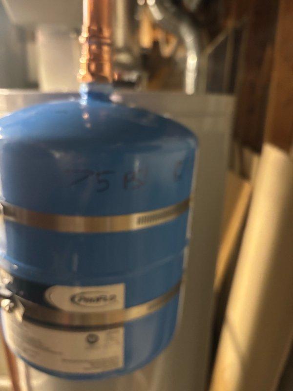 Installed a new 40-gallon State brand gas water heater with thermal expansion tank in the mechanical room. All copper supply lines were properly connected with brass fittings and shutoff valves, gas line was installed with appropriate shutoff valve, and the blue thermal expansion tank was mounted and plumbed according to code requirements to protect against thermal expansion in the closed water system.