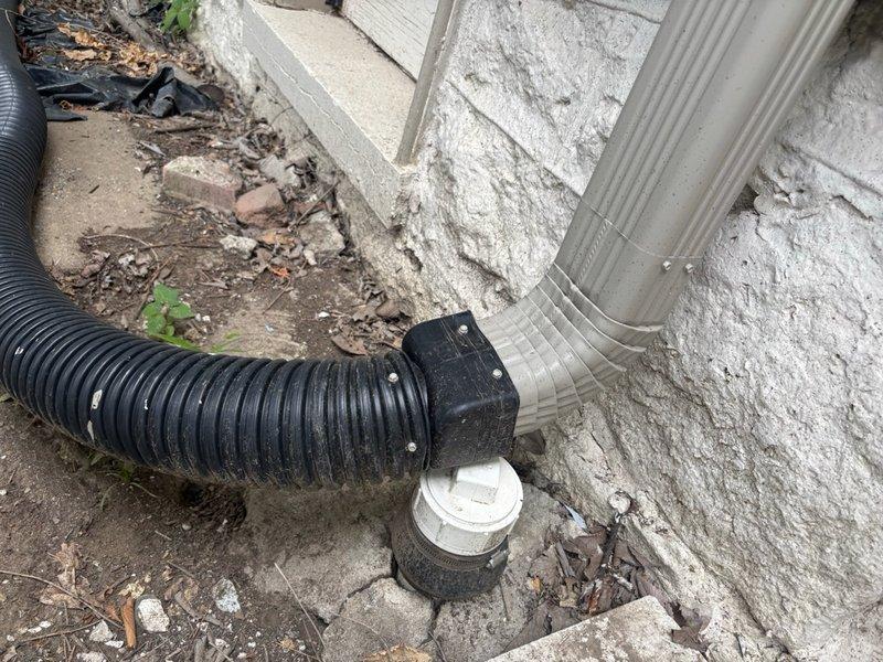 Responded to clogged floor drain in basement. Upon inspection, located the drainage system and assessed the blockage situation. Cleared the obstruction from the floor drain line and verified proper water flow through the system. Inspected related drainage components including exterior downspout connections and mechanical space plumbing to ensure no additional blockages or issues were present. System restored to full functionality with proper drainage confirmed.