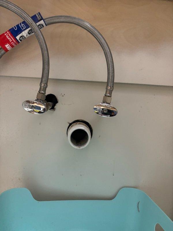 Replaced bathroom shut off valves on main level with new chrome-finished quarter-turn valves and braided stainless steel flexible supply lines. Removed old corroded valves, installed new units with escutcheons flush-mounted to wall, and connected supply lines to ensure proper water flow control to bathroom fixtures.