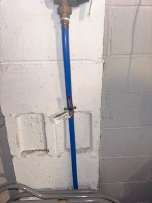 Responded to no hot water complaint at residential property. Performed diagnostic assessment of gas water heater located in basement utility area. Conducted visual inspection of unit and associated plumbing connections, including hot and cold water supply lines (PEX piping with brass fittings). Documented existing water heater configuration and current condition through photographic records. Provided estimate for water heater repair or replacement options to restore hot water service to the residence.
