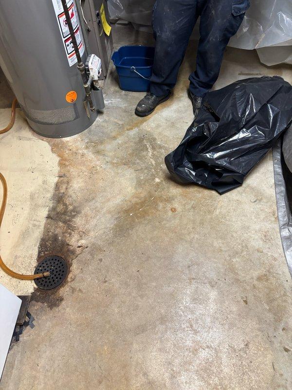 Performed hydro-jetting service on interior drain line in residential basement utility area. Deployed jetting equipment from service vehicle through garage access point, routing hose through residential space to reach basement drain system. Successfully cleared blockage and restored proper drainage flow through affected line. Water heater and surrounding plumbing connections remained protected during service operation. Removed equipment upon completion and confirmed drain functionality.