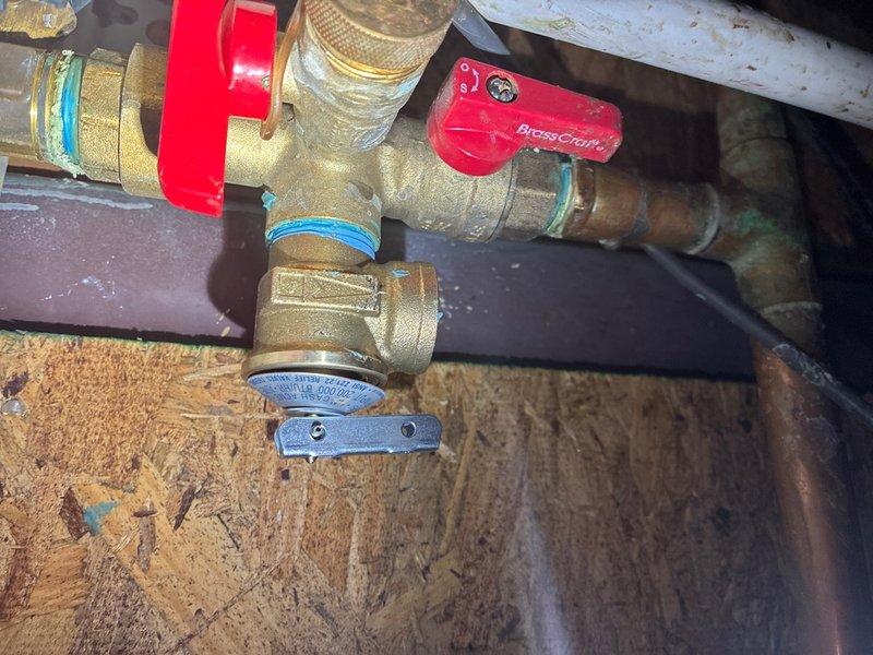 Responded to service call for tankless water heater leak in basement and toilet flapper replacements. Inspected tankless water heater installation and identified minor leak at brass fitting connections. Tightened compression fittings and ball valve connections, verified proper thread seal on joints, and confirmed leak was resolved. Replaced worn toilet flappers in two separate toilets to restore proper flush function and eliminate water waste. All plumbing systems tested and verified operational upon completion.