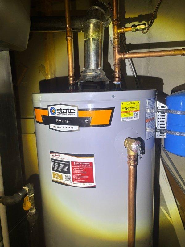 Documented newly installed State ProLine+ commercial-grade water heater by photographing serial number plate and installation details per service request. Verified proper installation including copper piping connections, expansion tank mounting, gas shutoff valve accessibility, and venting configuration.