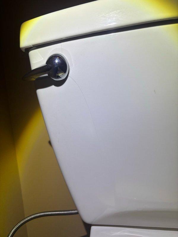 Responded to master bathroom for reported cracked toilet tank. Upon inspection, confirmed tank damage requiring full toilet replacement. Removed existing standard-height toilet and installed new elongated comfort-height toilet per customer specifications. Reconnected water supply line, tested flush mechanism for proper operation, and verified all seals for leak-free performance.