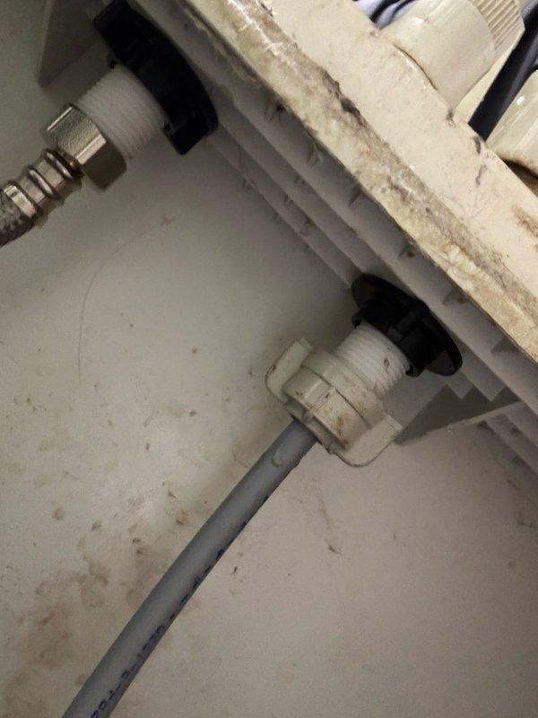 Responded to reported water leak in basement. Upon inspection, identified leak originating from plumbing connections mounted to wall near water heater and laundry appliances. Repaired faulty pipe fittings secured with rubber grommets, tightened hex nut connections on braided flex line, and verified integrity of PVC pipe connections. Tested all repaired connections under pressure to confirm leak was resolved. System restored to proper working condition with no active leaks detected.
