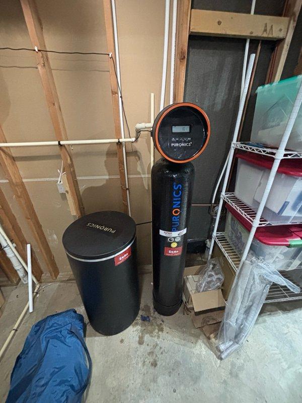 Completed carbon media replacement service on Puronics water softener system. Swapped out exhausted carbon filtration media with fresh activated carbon to restore optimal water treatment performance and contaminant removal capacity. System tested and returned to normal operation following media exchange.