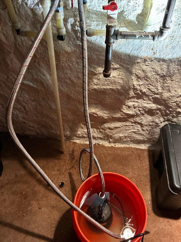 Performed routine maintenance flush on electric tankless water heater located in basement for new preventive maintenance agreement member. Successfully completed descaling procedure using appropriate chemicals to remove mineral buildup and maintain optimal unit performance. Verified system pressure and operational functionality upon completion.
