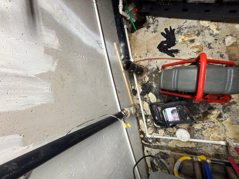 Performed sewer line camera inspection to assess underground drainage system condition. Accessed utility space containing plumbing infrastructure and deployed video inspection equipment through accessible cleanout points. Successfully captured visual documentation of interior pipe conditions to identify any blockages, damage, or areas requiring attention.