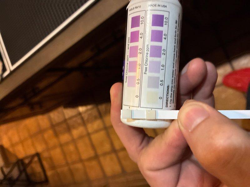 Responded to service call for non-functioning water softener system in basement. Performed diagnostic testing of water quality using test strips to measure chlorine and mineral levels, then inspected the water treatment system including digital control valve and brine tank. Verified proper operation of equipment, checked electrical connections, and confirmed system settings on the digital display panel were correctly programmed for optimal water conditioning performance.