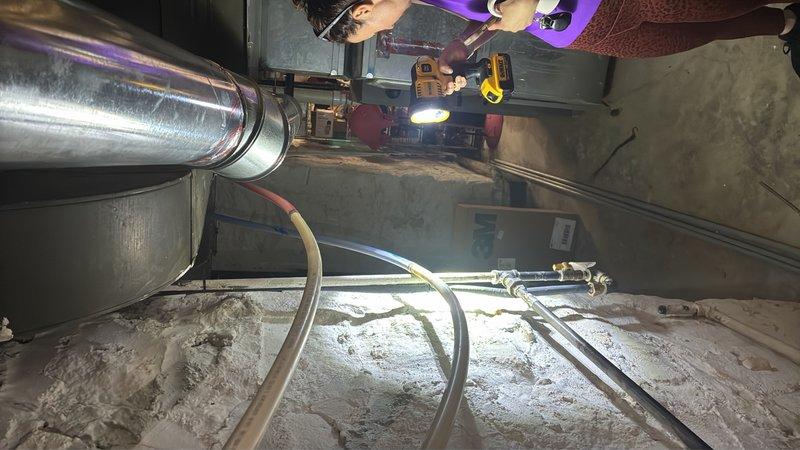 Conducted on-site evaluation of 25+ year old gas water heater in basement showing signs of active failure. Assessed existing 50-gallon gas unit, documented corroded copper supply lines with significant green patina oxidation, and evaluated surrounding plumbing infrastructure including condition of pipe connections and fittings. Provided detailed estimate for replacement of aging water heater system with new 50-gallon gas unit, including necessary updates to deteriorated supply piping and proper venting requirements.