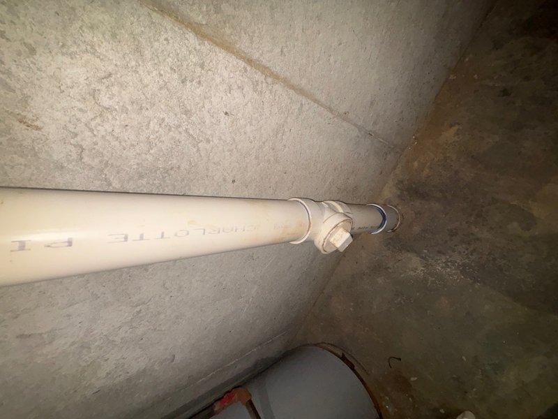 Completed plumbing maintenance visit addressing Schedule 40 PVC drainage piping and toilet fill valve system. Inspected and documented basement drainage pipe installation with proper mounting brackets and elbow fittings, confirming secure attachment and functional condition. Serviced toilet tank components including Fluidmaster fill valve assembly with dual float mechanism, verifying proper operation of water supply and flush system.