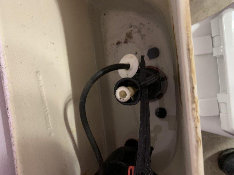 Responded to warranty callback for toilet repair previously completed in November 2024. Upon arrival, water supply was already shut off by occupant due to active leak. Inspection revealed that a component from the flush valve assembly installed during previous service had detached, causing water to spray from the tank. Disassembled and reinstalled the flush valve assembly, ensuring all mounting points and connections were properly secured. Tested system operation, verified no leaks present, and confirmed proper flush function before returning unit to service.