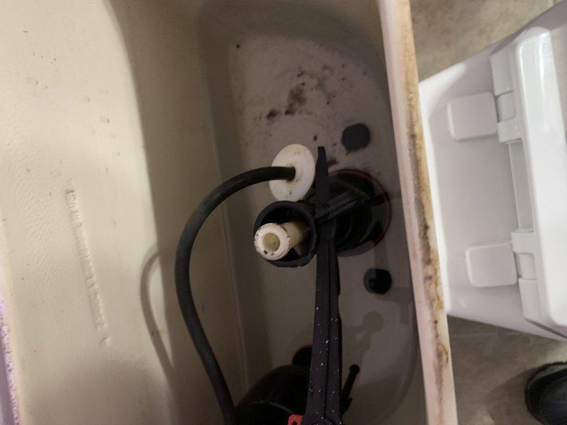 Responded to warranty callback for toilet repair previously completed in November 2024. Upon arrival, water supply was already shut off by occupant due to active leak. Inspection revealed that a component from the flush valve assembly installed during previous service had detached, causing water to spray from the tank. Disassembled and reinstalled the flush valve assembly, ensuring all mounting points and connections were properly secured. Tested system operation, verified no leaks present, and confirmed proper flush function before returning unit to service.