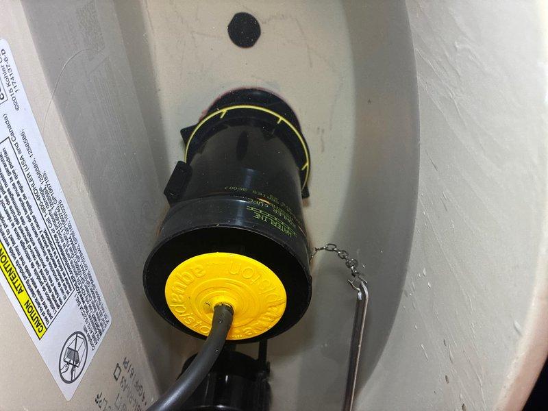 Responded to a toilet flush valve leak where water level continued to rise after initial adjustment. Inspected toilet tank components and identified faulty fill valve assembly causing continuous water flow. Replaced the fill valve mechanism with new unit, adjusted water level to proper height below overflow tube, tested flush cycles for proper operation, and verified complete seal with no residual leaking. Checked supply line connection at angle stop valve for any signs of deterioration or leakage. All components now functioning properly with stable water level maintained in tank.