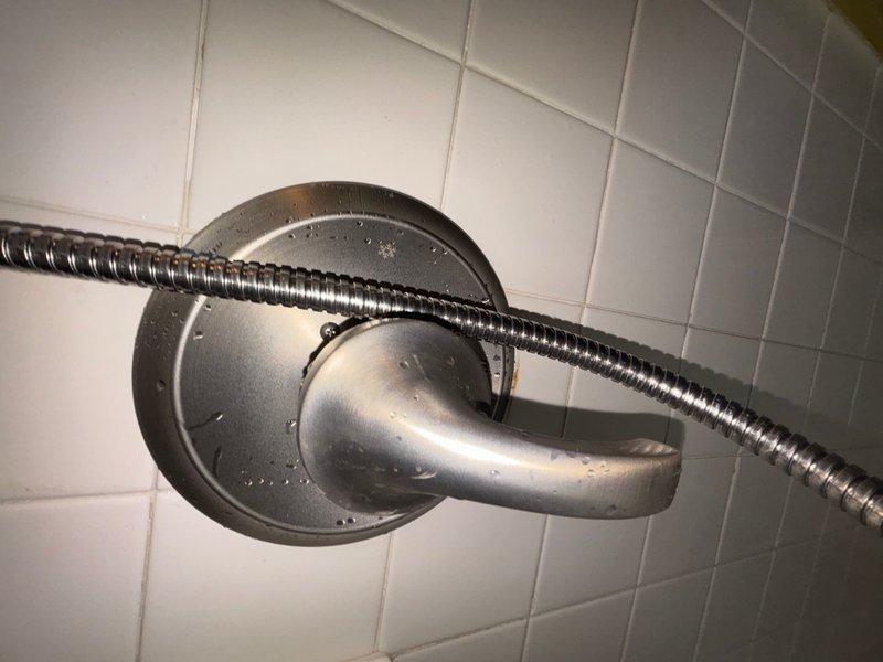 Installed customer-supplied shower valve rough-in assembly and reconstructed the shower P-trap system, replacing both 2-inch and 1½-inch drain piping to ensure proper drainage and code compliance. The installation included mounting the valve body, connecting supply lines, and verifying all connections for leaks prior to wall closure, with trim installation to be completed at a later date.