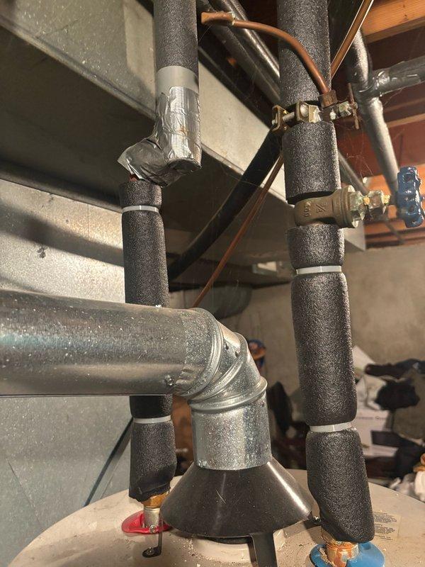 Conducted on-site assessment of 20-year-old gas water heater to provide replacement estimate. Inspected existing unit, which is currently operational but has reached end of expected service life. Documented water heater specifications including 150 PSI maximum working pressure rating, gas control assembly with temperature and pilot control system, and connection points. Evaluated supply and discharge piping configuration, including insulated hot and cold water lines with brass fittings and shutoff valves. Photographed existing installation to document current setup and facilitate accurate replacement planning for new water heater installation.