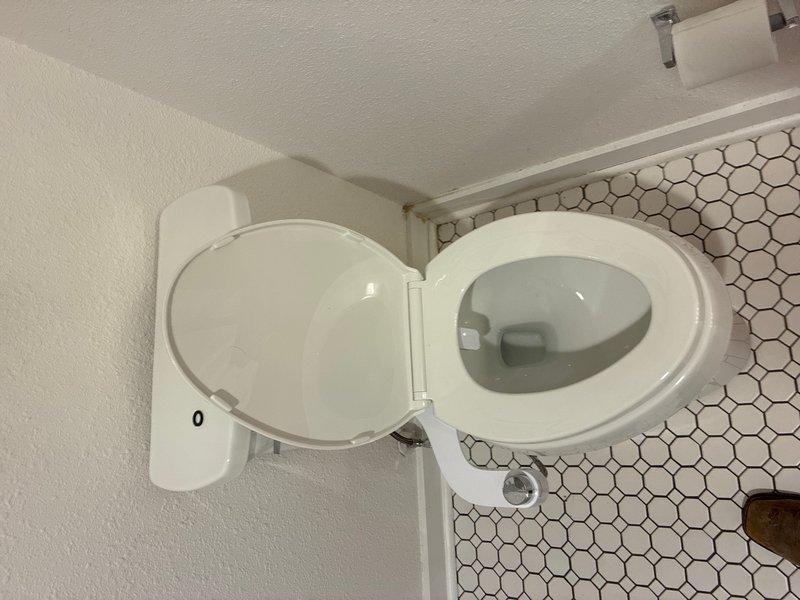 Installed customer-supplied toilet on main level bathroom. Removed existing fixture, set new toilet on hexagonal tile flooring, secured unit to flange, connected water supply line, and tested for proper operation and leaks. Installation completed successfully with no issues.