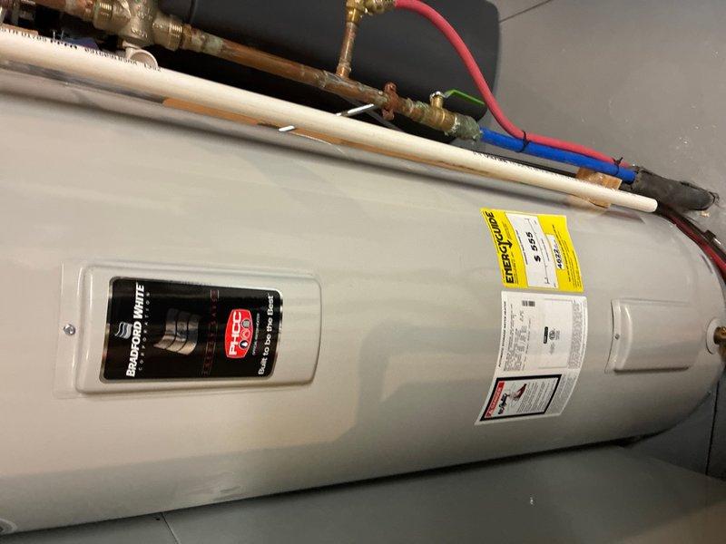 Performed routine maintenance flush on 50-gallon tanked water heater located in basement mechanical room. Drained sediment buildup from tank bottom through drain valve, cleared mineral deposits to restore heating efficiency and extend unit lifespan. Inspected all plumbing connections, pressure relief valve, and associated copper and PEX supply lines during service; all components found in proper working condition with no leaks detected.