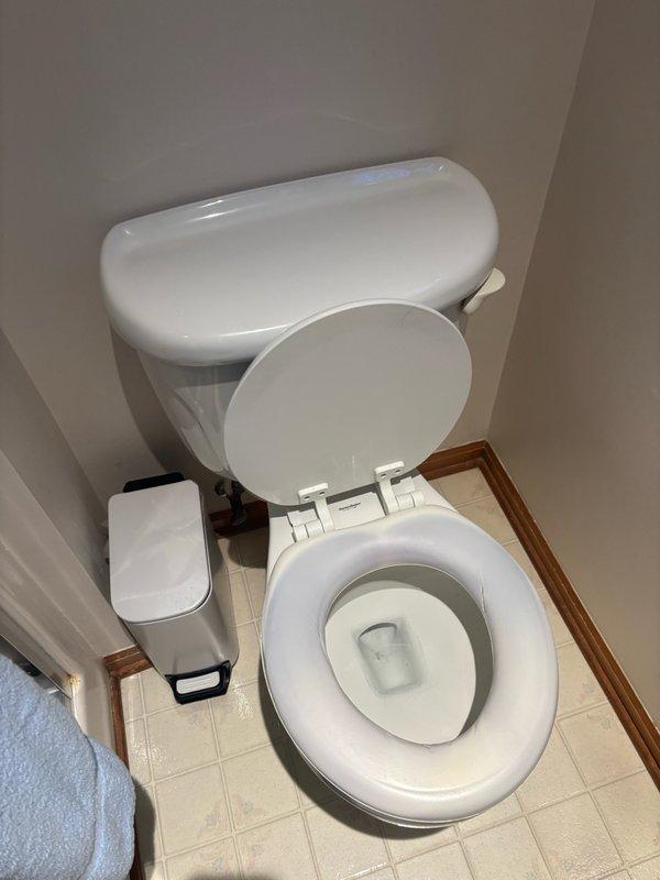Responded to service call for clogged toilet in residential bathroom. Upon arrival, assessed the fixture and surrounding plumbing connections. Successfully cleared the obstruction using professional drain clearing equipment and techniques. Tested toilet functionality through multiple flush cycles to ensure proper drainage and confirm complete resolution of the blockage. Verified water supply line connections and fill valve operation were functioning correctly. Left bathroom fixtures clean and in proper working order.