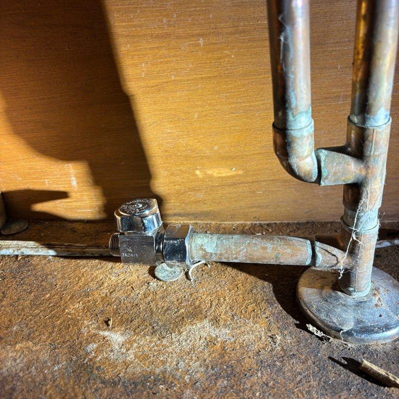 Replaced faulty water shut-off valve under kitchen sink to restore proper water pressure and installed new dishwasher connection. The existing valve showed signs of corrosion and age-related wear, which was causing restricted water flow to the kitchen fixtures. All plumbing connections were secured with proper fittings and tested for leaks upon completion.