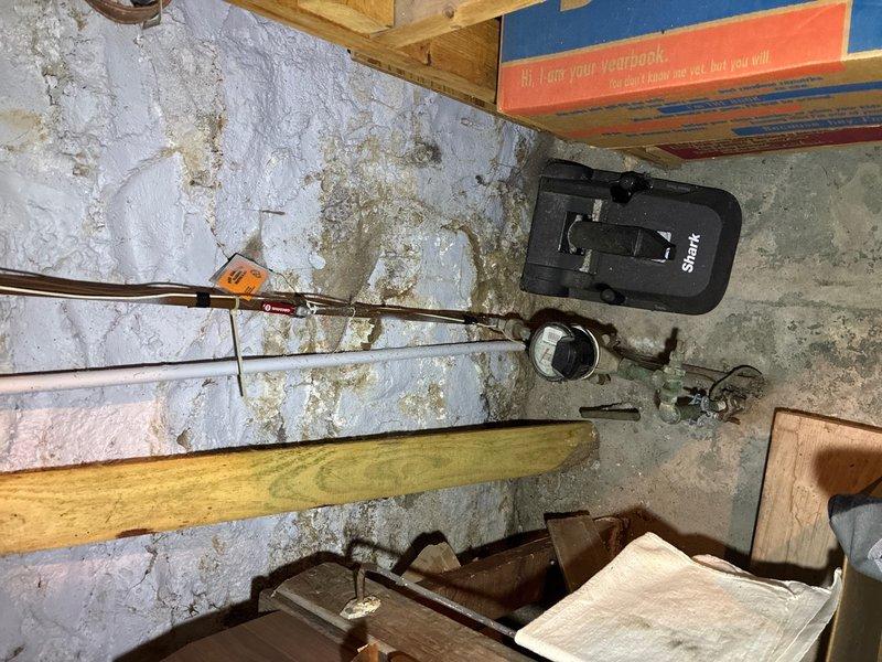 Responded to hot water heater issue in basement. Upon inspection, found existing 50-gallon gas water heater manufactured in June 2009 showing signs of failure with evidence of water leakage on concrete floor, indicated by extensive efflorescence and brownish-yellow water staining. Assessed unit as beyond economical repair due to age and condition. Provided estimate for replacement with new gas water heater featuring self-cleaning technology and Guardian System protection. Documented existing unit specifications including 4.0" manifold and BTU rating, photographed installation area and current equipment condition for estimate records.