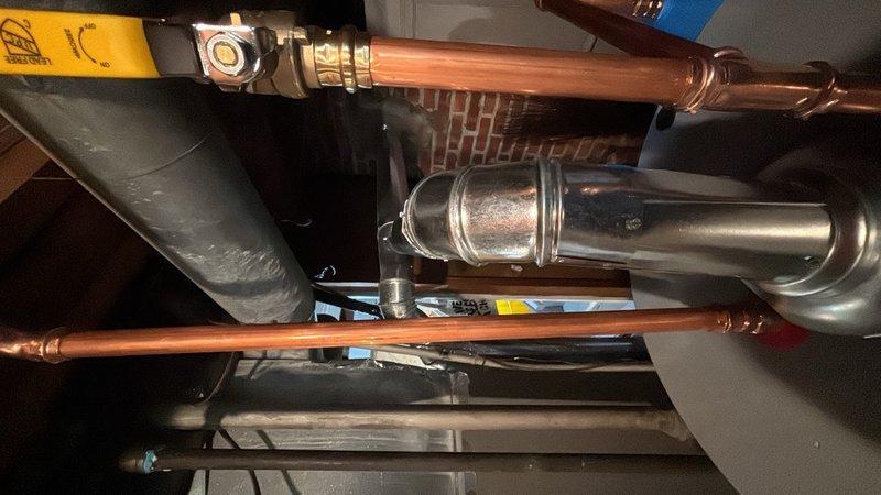 Installed a 50-gallon gas water heater in the mechanical room with proper venting and gas line connections. Added a thermal expansion tank to the cold water supply line to protect the system from excess pressure buildup. All copper piping, fittings, and connections were completed to code specifications, with the unit properly mounted and secured to the wall structure.