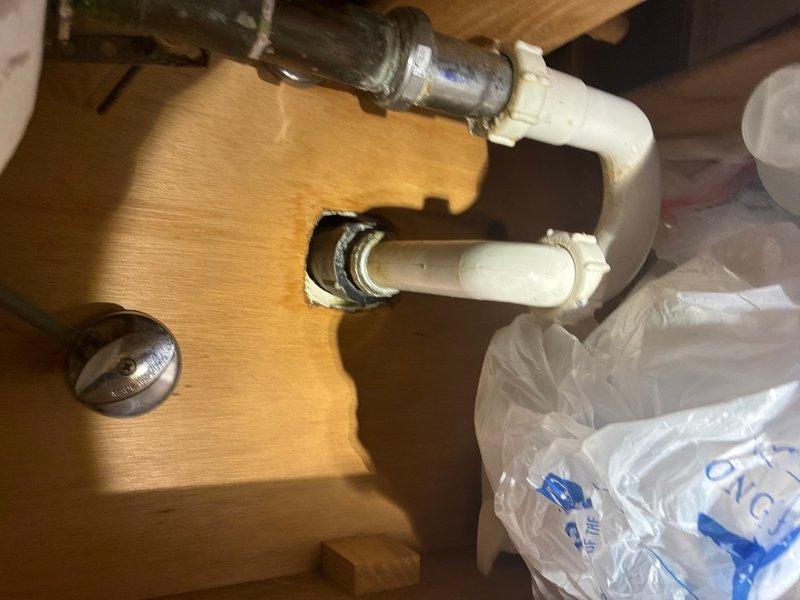 Completed preventive plumbing maintenance inspection on one unit. Assessed water heater condition, noting significant rust and corrosion on exterior metal surfaces with extensive deterioration patterns. Verified sight glass level indicator functionality and reviewed equipment warranty information. Replaced P-trap assembly under sink with new white PVC components, including proper U-bend configuration. Installed new drain strainer and verified all connections for proper seal and drainage. All plumbing components tested and functioning properly upon completion.