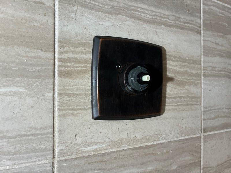 Responded to service call for shower cartridge replacement in bathroom. Successfully removed existing worn cartridge from shower valve assembly and installed new replacement cartridge, ensuring proper seating and alignment within the valve body. Reinstalled escutcheon plate and tested operation to confirm proper temperature control and water flow, resolving the reported issue.