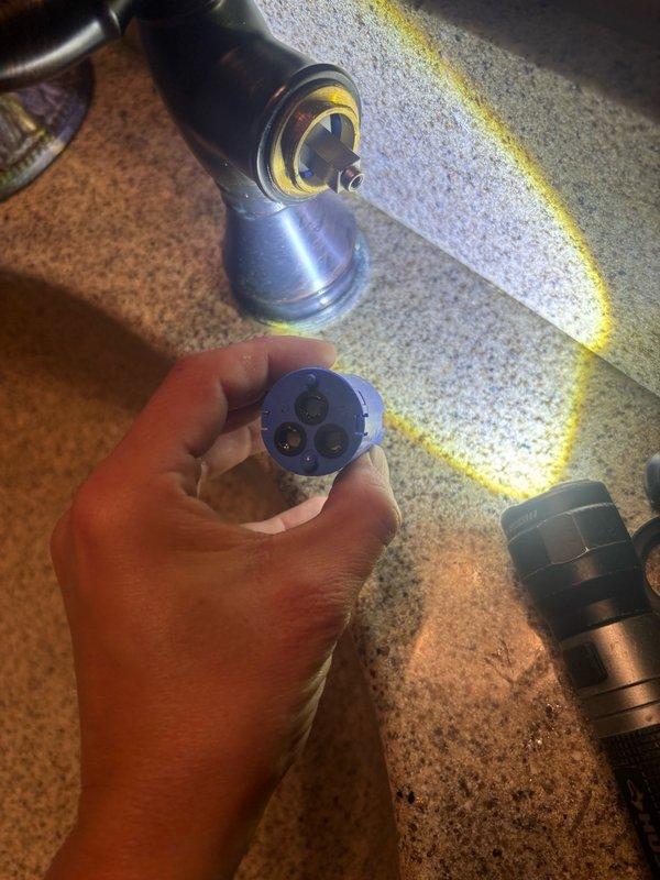 Responded to service call for shower cartridge replacement in bathroom. Successfully removed existing worn cartridge from shower valve assembly and installed new replacement cartridge, ensuring proper seating and alignment within the valve body. Reinstalled escutcheon plate and tested operation to confirm proper temperature control and water flow, resolving the reported issue.