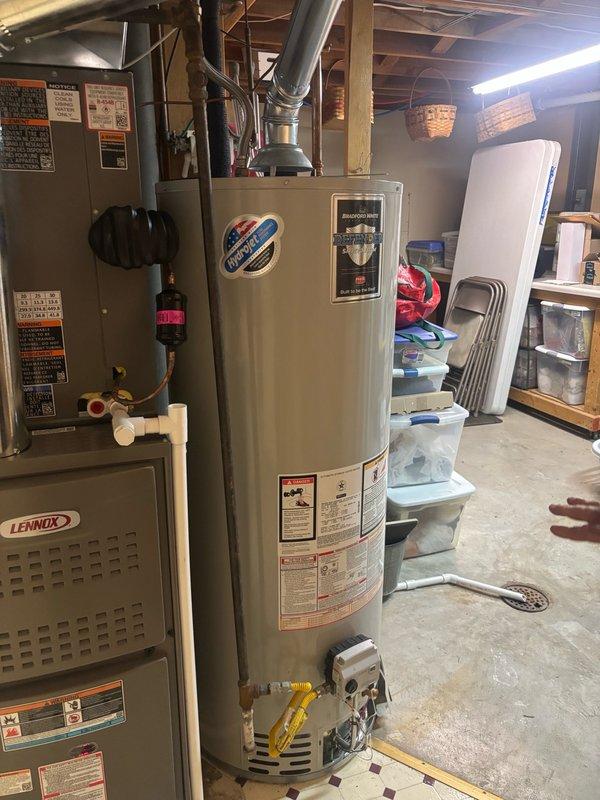 Responded to no hot water complaint as possible recall from recent full HVAC installation. Upon assessment, confirmed water heater required attention in basement utility area alongside recently installed Lennox 16 SEER2 3-ton air conditioner, Lennox 80% single-stage 90,000 BTU furnace, and associated components. Evaluated tanked water heater system, including venting configuration and gas line connections. Inspected metallic vent pipe, flexible gas lines, and ventilation housing at base of unit. Verified proper clearances around water heater and surrounding HVAC equipment. Assessed all manufacturer labels, safety warnings, and specification plates for compliance. Examined connections between water heater and existing plumbing infrastructure. Documented equipment condition and installation quality through photographic documentation. Restored hot water service to residential property and confirmed system operational upon completion.