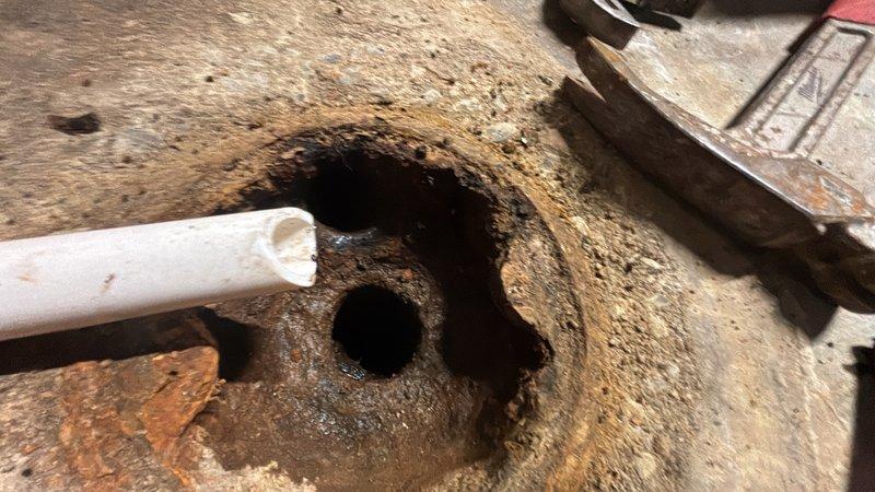 Responded to basement drain backup for non-member property. Performed main line cleanout through floor drain access point, removing obstruction causing sewage backup in basement area. Successfully cleared blockage and restored proper drainage flow through main sewer line.