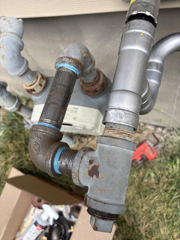 Installed new gas line from existing meter to fire pit location. Ran 1" black iron pipe along foundation wall, reduced to 3/4" black iron, then transitioned to 3/4" yellow polyethylene pipe for underground run with stub-up above grade at termination point. Coordinated with pool company for trenching and excavation work. Completed pressure testing and leak check of entire installation to verify system integrity and code compliance.
